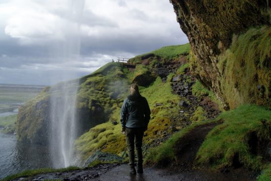 Follow the trail behind the falls at Seljalandsfoss, South Iceland