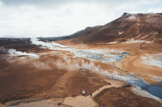 See the smoking fumaroles and boiling mud pots of the Namafjall Geothermal area in Namaskard, North Iceland