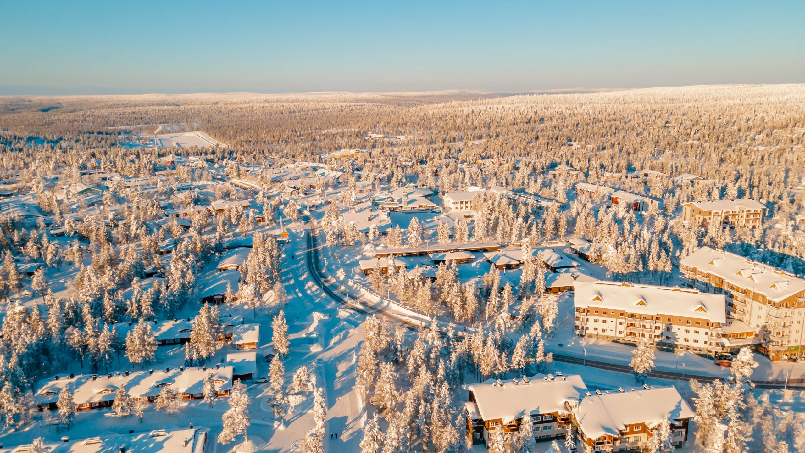 Aerial view of snowy village in winter, lapland finland.